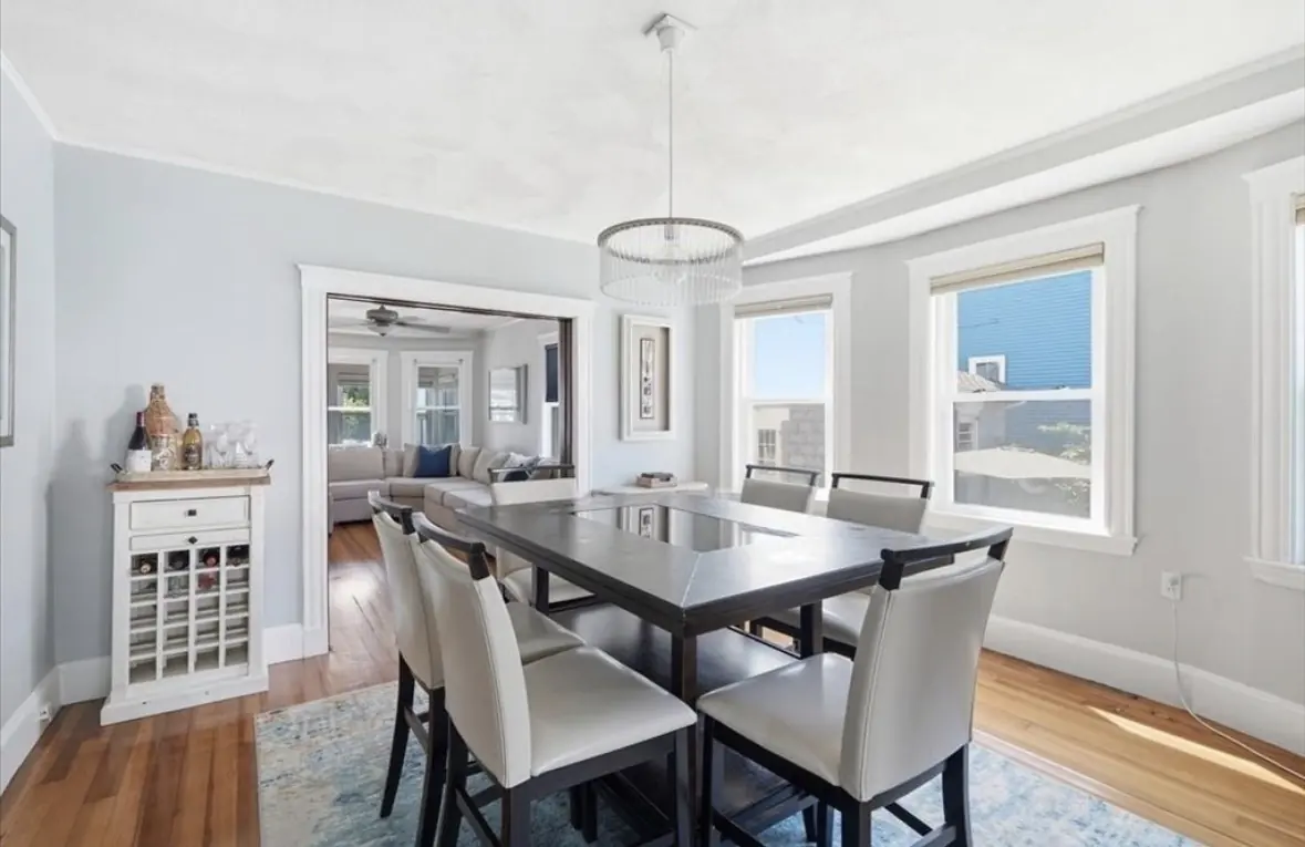 Dining room with bay windows and a large table