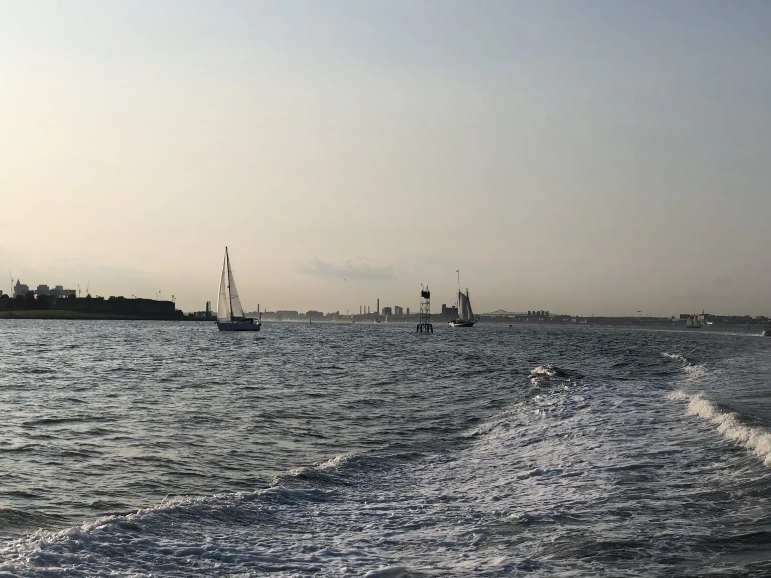Sailboats moored in the harbor off Hull on a summer afternoon