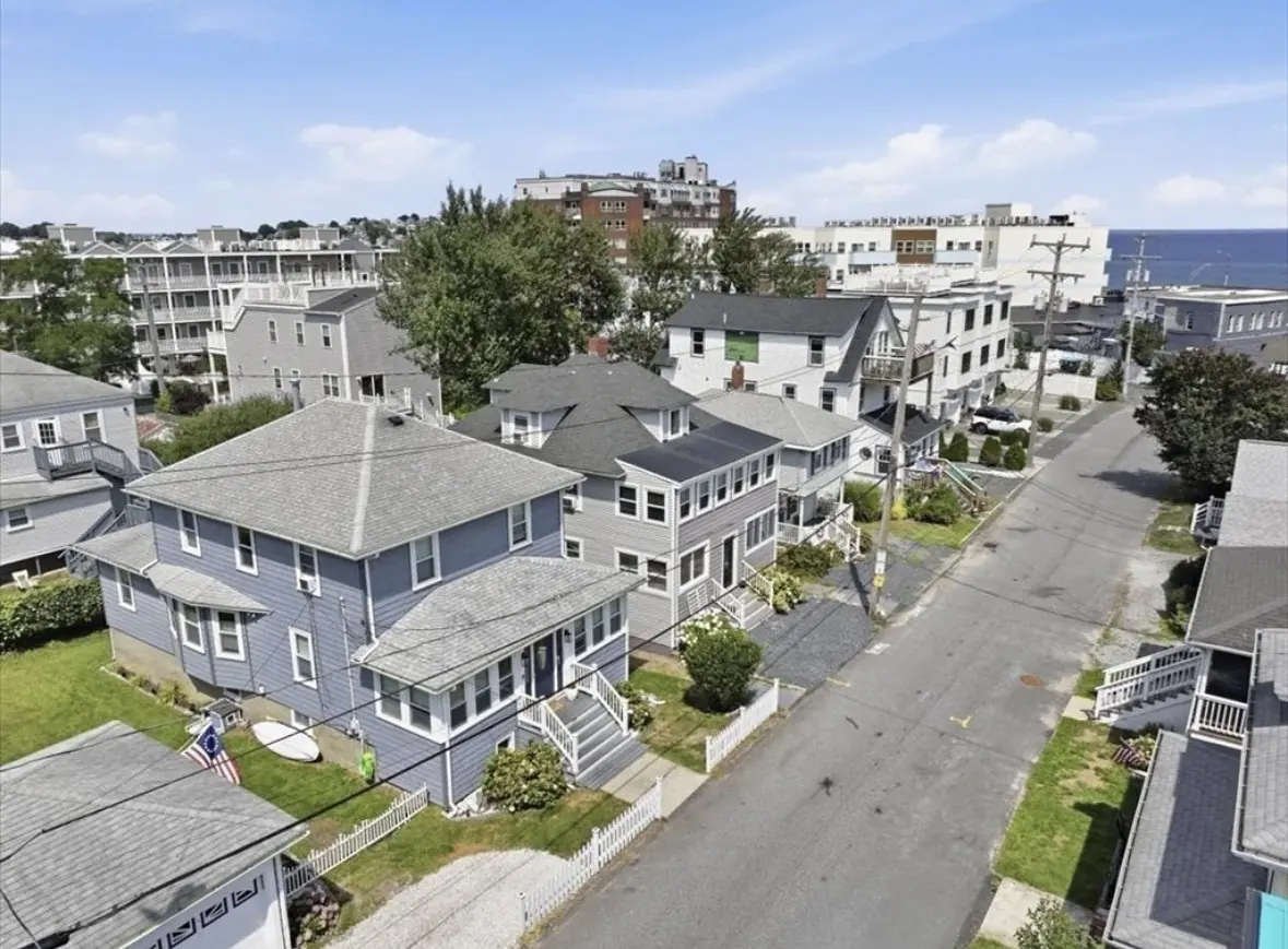 Drone view down Berkley Road in Hull with the ocean at the end of the street